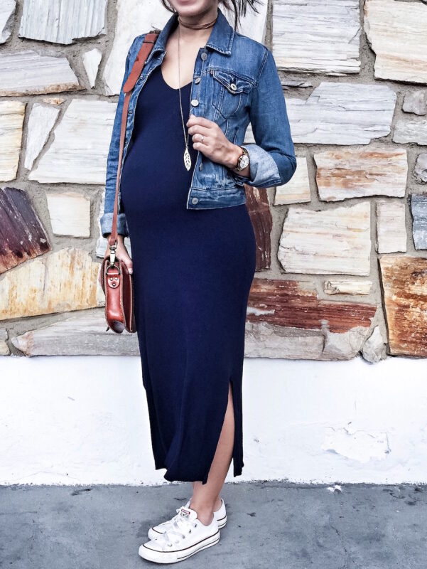 A happy pregnant woman in a stylish and comfortable maternity outfit, radiating confidence and joy.Maternity Fashion